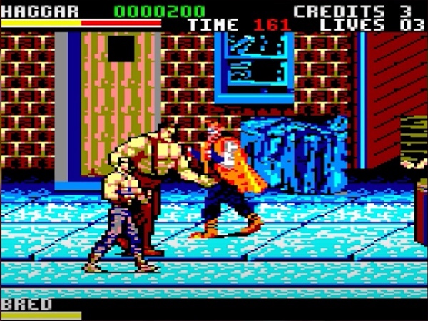 Final Fight for Amstrad CPC. / 8-bit video game screenshot with a street brawl between a shirtless wrestler and two thugs. This image is a cropped screen grab from a Digital Foundry YouTube video. / Image credit: Capcom