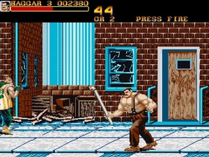 Final Fight for Commodore Amiga / 16-bit game graphics depicting a shirtless wrestler holding a pipe weapon on a city street. / Image credit: Capcom